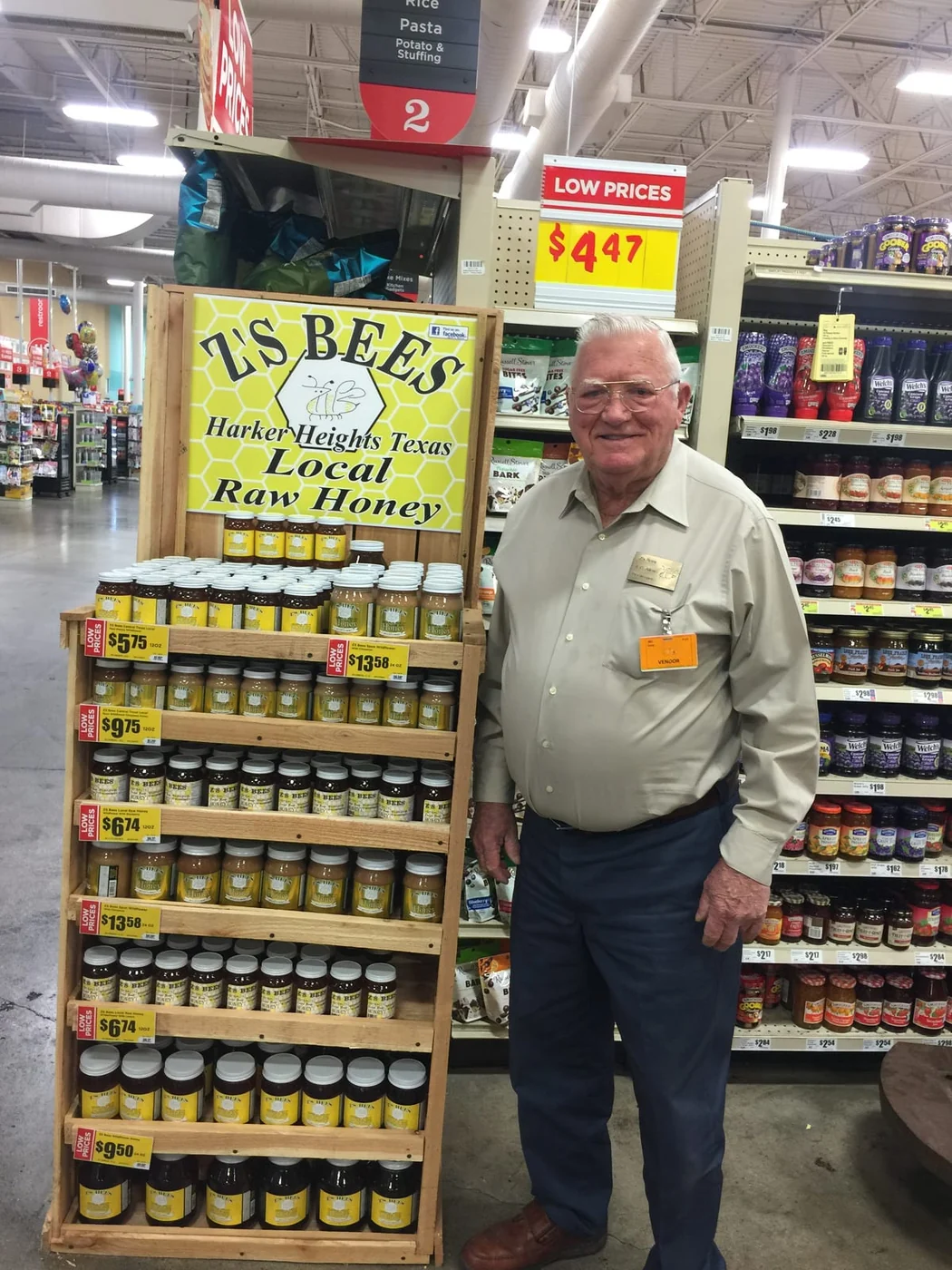 Mike’s grandfather beside the family’s Z’s Bees honey display